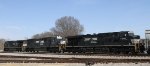 NS 2557 & 7601 roll through town with an empty grain train